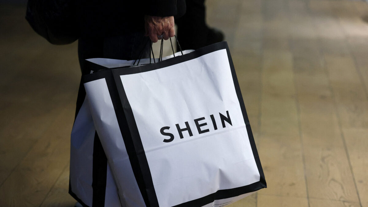 Customer holding SHEIN shopping bags